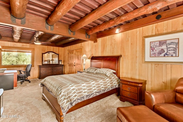 bedroom with beamed ceiling, wood ceiling, carpet floors, and wood walls