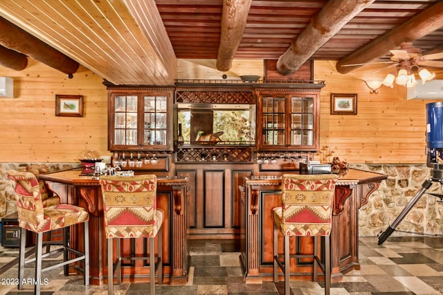 bar featuring ceiling fan, beam ceiling, a wall unit AC, wooden ceiling, and tile floors