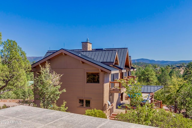 view of side of property with a mountain view