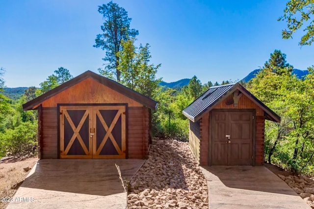 view of outdoor structure with a mountain view