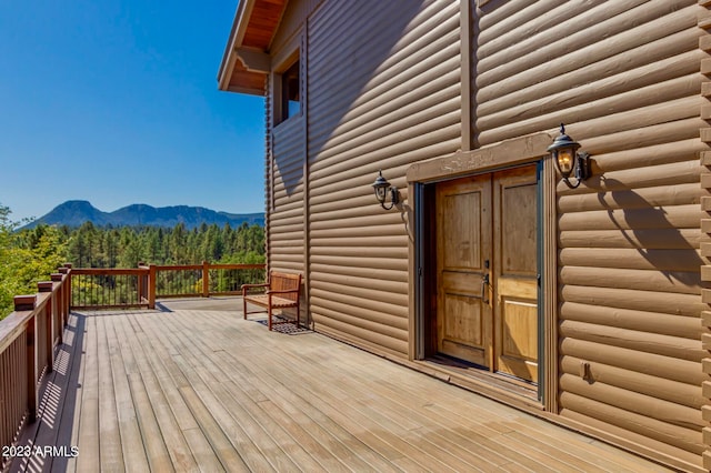 wooden terrace featuring a mountain view