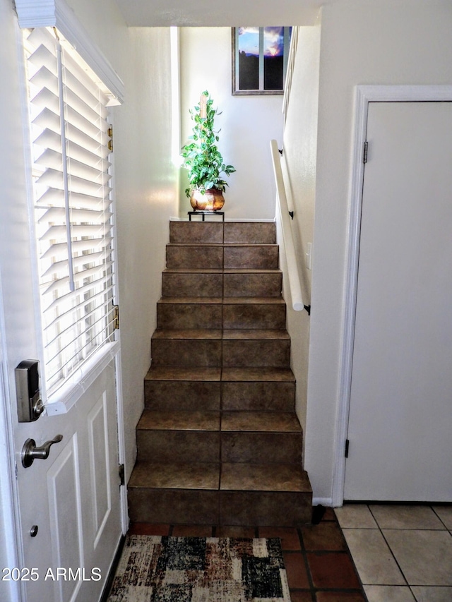 staircase with tile patterned flooring