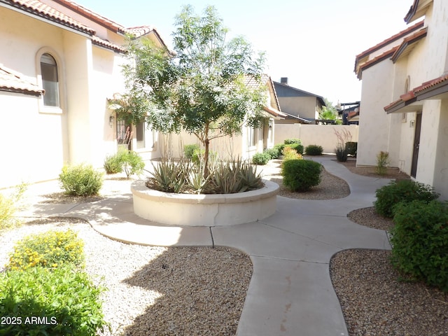 view of yard featuring fence and a patio area