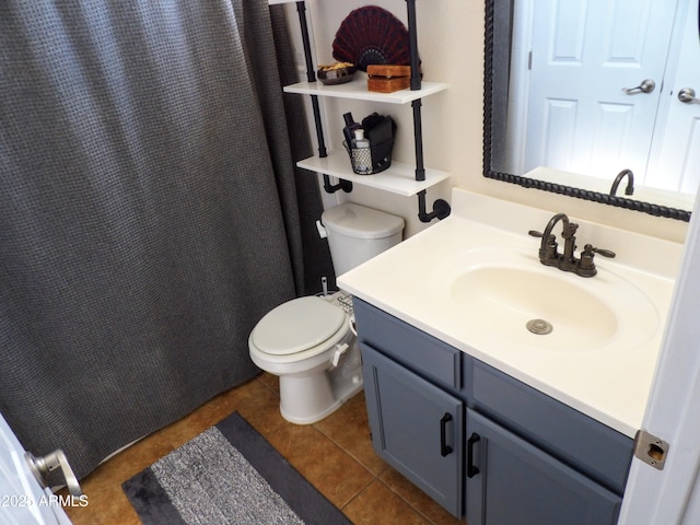 bathroom with vanity, tile patterned floors, and toilet