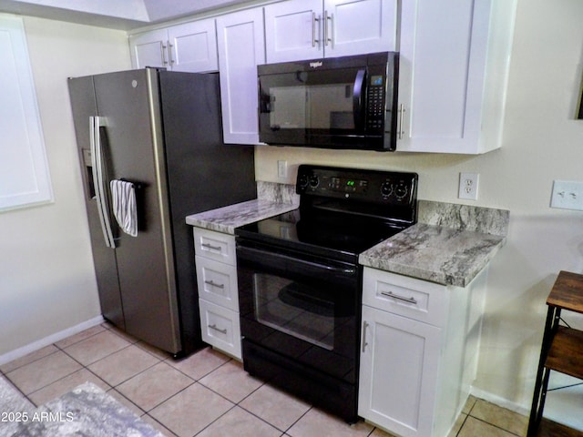 kitchen featuring white cabinets and black appliances