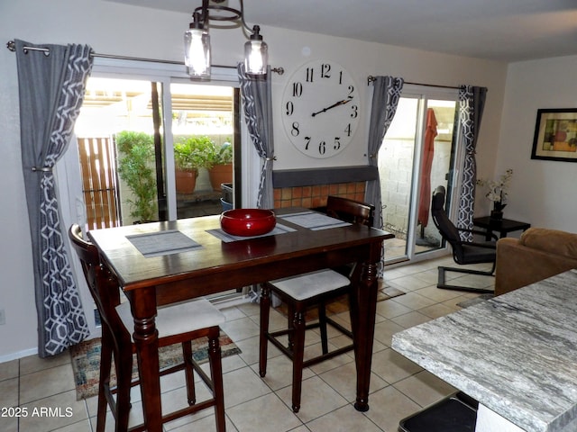 dining area featuring a healthy amount of sunlight and light tile patterned floors