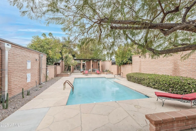 view of pool featuring a patio