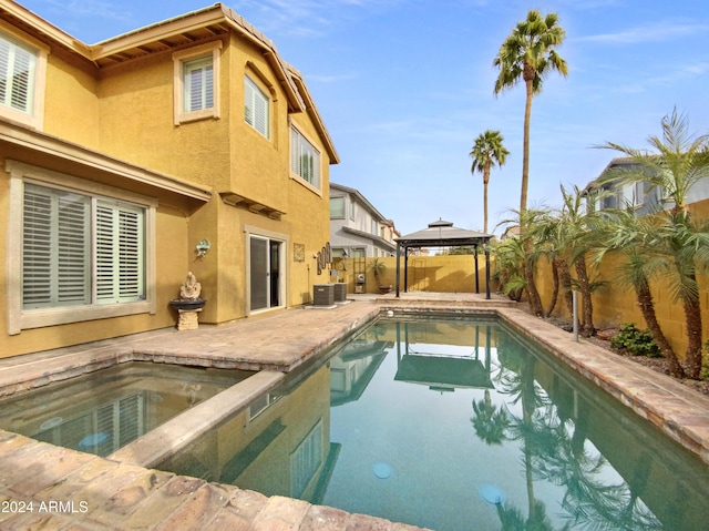 4319 E Vaughn Ave, Gilbert, AZ 85234 - view of swimming pool with a gazebo, a fenced backyard, and a patio