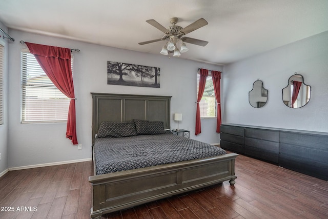 12503 W Vista Paseo Dr, Litchfield Park, AZ 85340 - bedroom with baseboards, ceiling fan, and dark wood-type flooring