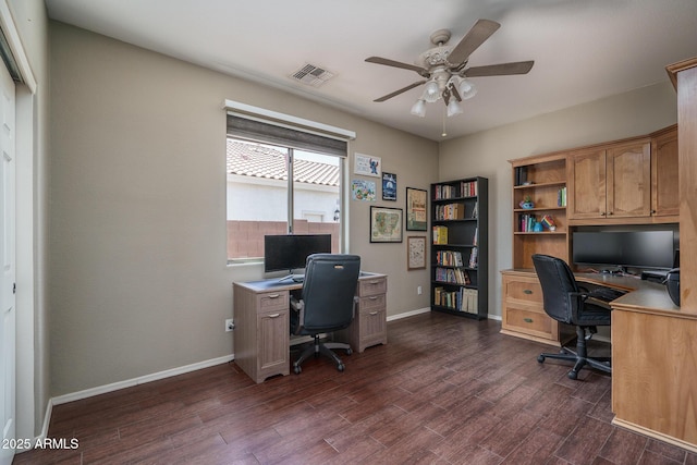 12503 W Vista Paseo Dr, Litchfield Park, AZ 85340 - office area featuring visible vents, a ceiling fan, dark wood-style flooring, and baseboards