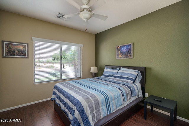 12503 W Vista Paseo Dr, Litchfield Park, AZ 85340 - bedroom featuring baseboards, a ceiling fan, wood finished floors, and visible vents