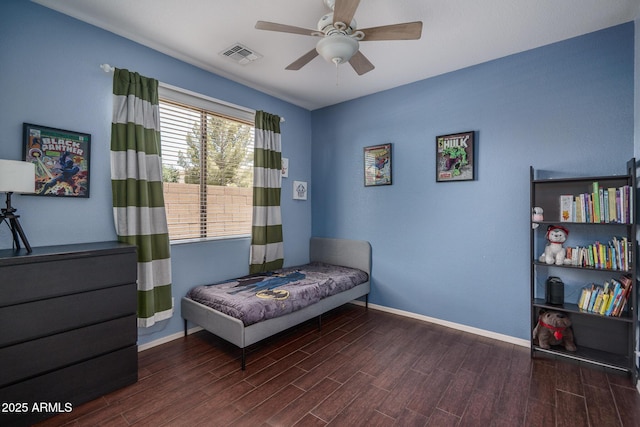 12503 W Vista Paseo Dr, Litchfield Park, AZ 85340 - bedroom featuring baseboards, visible vents, and wood finished floors