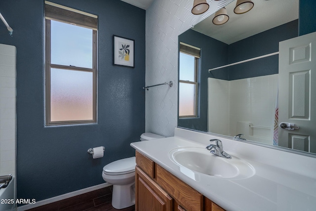 12503 W Vista Paseo Dr, Litchfield Park, AZ 85340 - full bathroom featuring toilet, baseboards, a wealth of natural light, and wood finished floors