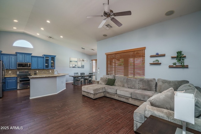 12503 W Vista Paseo Dr, Litchfield Park, AZ 85340 - living area featuring visible vents, a ceiling fan, dark wood-style flooring, and lofted ceiling