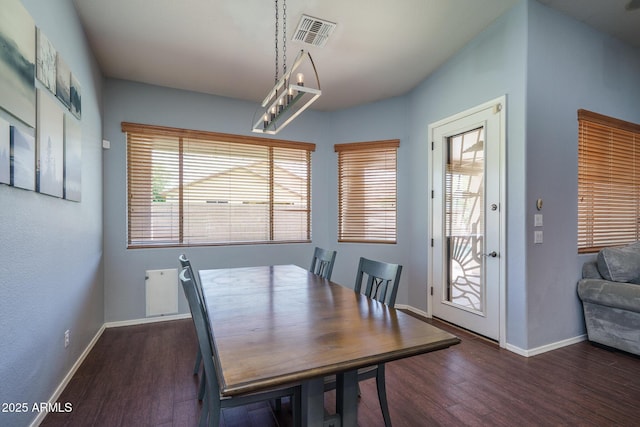 12503 W Vista Paseo Dr, Litchfield Park, AZ 85340 - dining area with baseboards, wood finished floors, and visible vents