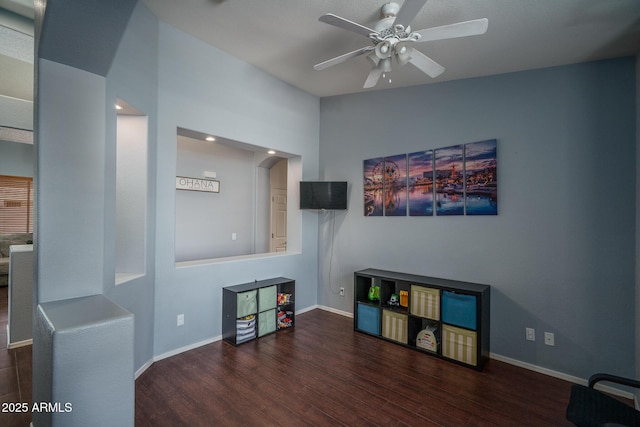 12503 W Vista Paseo Dr, Litchfield Park, AZ 85340 - living room with baseboards, a ceiling fan, and wood finished floors