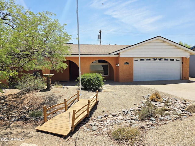 2027 N 81st St, Scottsdale, AZ 85257 - single story home with concrete driveway, a garage, stucco siding, and roof with shingles