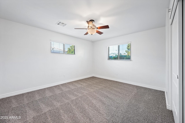 unfurnished room with carpet flooring, ceiling fan, and a healthy amount of sunlight