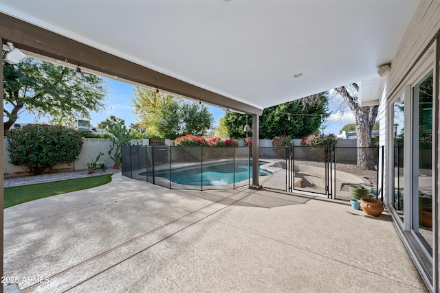 exterior space with a fenced in pool