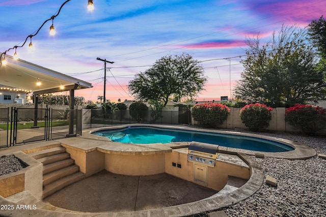 pool at dusk with a grill