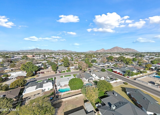 birds eye view of property featuring a mountain view