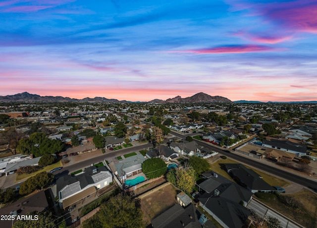 aerial view at dusk with a mountain view