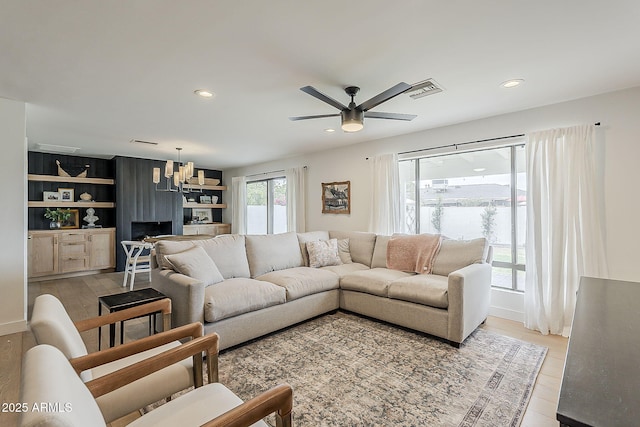 8320 E Monte Vista Rd, Scottsdale, AZ 85257 - living room featuring a ceiling fan, recessed lighting, and a chandelier