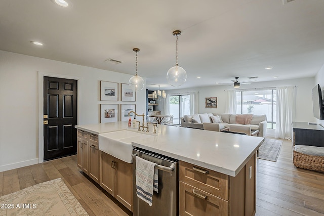 8320 E Monte Vista Rd, Scottsdale, AZ 85257 - kitchen with dishwasher, a sink, hardwood / wood-style floors, open floor plan, and a ceiling fan