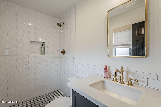 8320 E Monte Vista Rd, Scottsdale, AZ 85257 - full bathroom featuring vanity, a tile shower, toilet, decorative backsplash, and tile walls