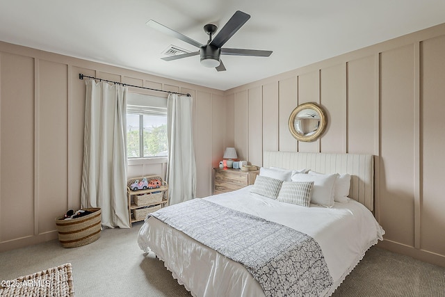 8320 E Monte Vista Rd, Scottsdale, AZ 85257 - bedroom with a decorative wall, light carpet, and ceiling fan