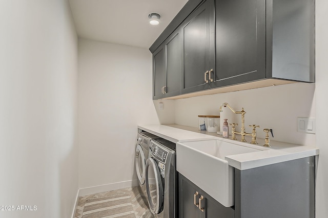 8320 E Monte Vista Rd, Scottsdale, AZ 85257 - laundry area featuring cabinet space, washing machine and clothes dryer, and baseboards