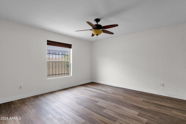 spare room with ceiling fan and hardwood / wood-style floors