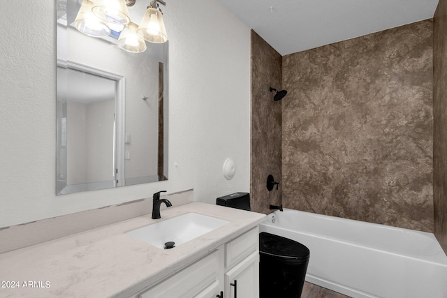 full bathroom with vanity, toilet, and tiled shower / bath combo