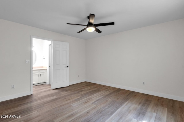 empty room featuring ceiling fan and light wood-type flooring