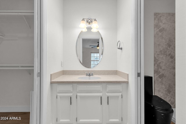 bathroom featuring vanity and ceiling fan