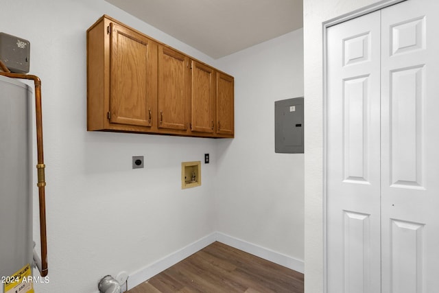 washroom with dark hardwood / wood-style floors, cabinets, washer hookup, electric panel, and electric dryer hookup