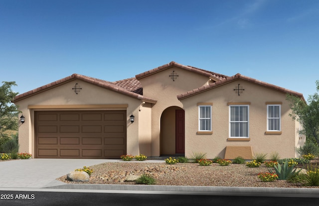 mediterranean / spanish-style house with a garage