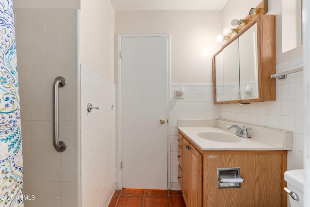 bathroom with vanity, tile walls, tile patterned floors, and a shower with shower curtain