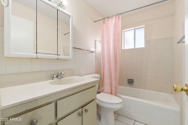 full bathroom featuring shower / bathtub combination with curtain, tile walls, tile patterned flooring, vanity, and toilet