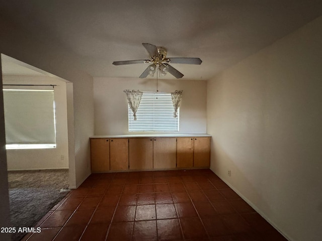 unfurnished room featuring ceiling fan