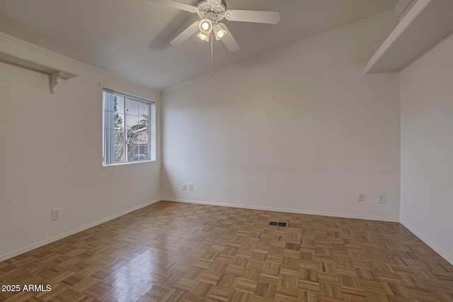 unfurnished room featuring ceiling fan, light parquet flooring, and lofted ceiling