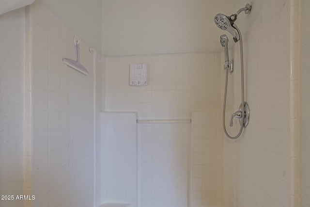 interior details with a tile shower