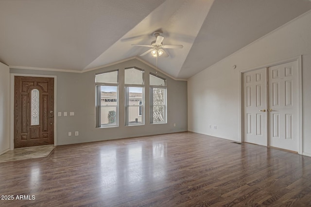 entrance foyer featuring vaulted ceiling, ceiling fan, and dark hardwood / wood-style flooring