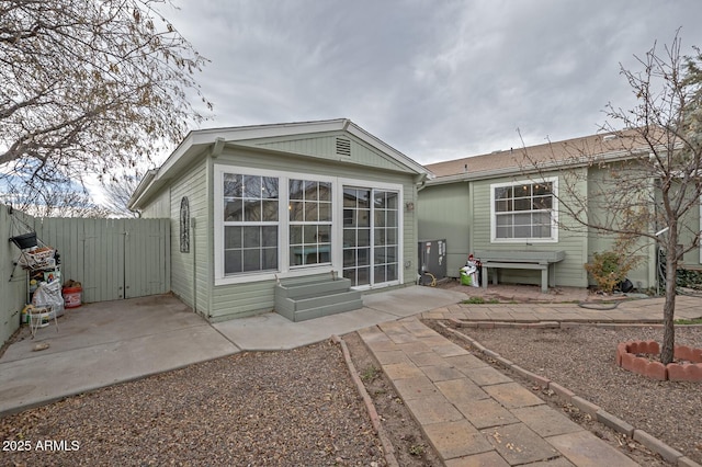 rear view of property featuring a patio