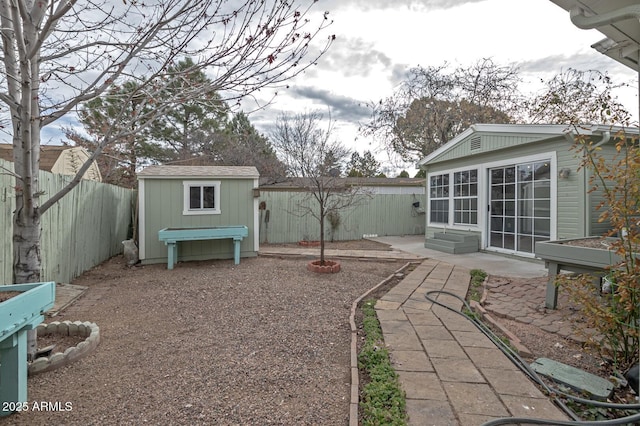 view of yard with a patio area and a storage unit