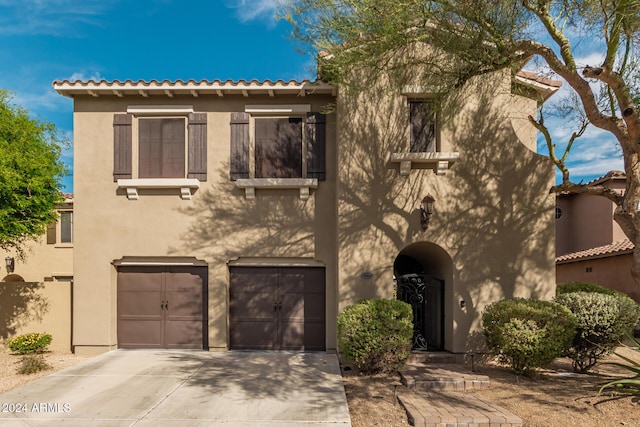 3964 E Hummingbird Ln, Phoenix, AZ 85050 - view of front facade with concrete driveway, stucco siding, and a garage