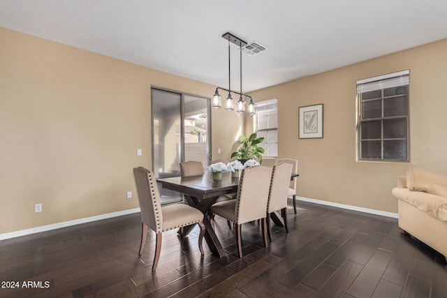 3964 E Hummingbird Ln, Phoenix, AZ 85050 - dining room featuring baseboards and dark wood finished floors