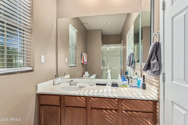 3964 E Hummingbird Ln, Phoenix, AZ 85050 - full bath featuring a shower stall, vanity, and a textured wall