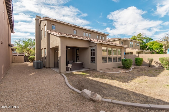 3964 E Hummingbird Ln, Phoenix, AZ 85050 - back of house with stucco siding, central air condition unit, a fenced backyard, a patio area, and a tile roof