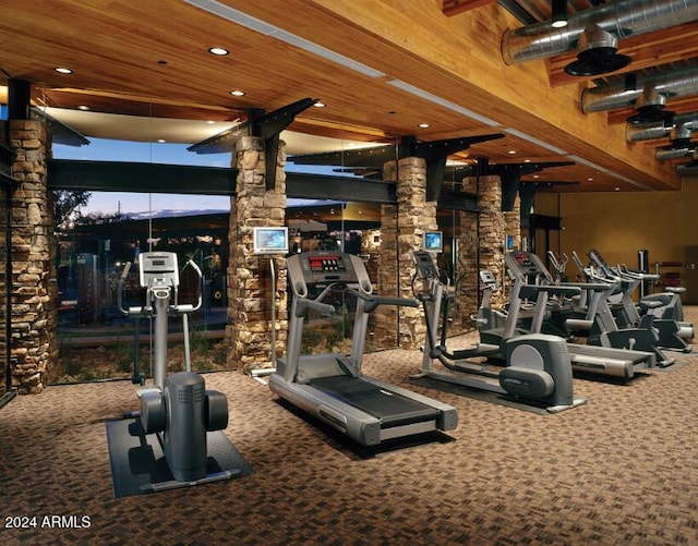 3964 E Hummingbird Ln, Phoenix, AZ 85050 - gym with decorative columns, carpet flooring, and recessed lighting